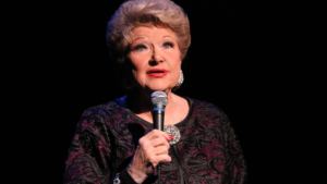 I recently came across this article that I had stashed in a drawer a little over a year ago, when my cabaret guru, teacher, arranger and ass kicker Marilyn Maye was about to turn 88 years old. As of this writing, she’s just swept past 89. Yes, you heard that right. While most people in their late 80’s are waiting for the reaper, Marilyn is out there headlining in top venues, for packed houses of cabaret lovers, who appreciate being blown out of their seats by still, one of the most charming, captivating and outright dynamic performers of the past…well…almost 90 years! More importantly, Marilyn is a truly nice person who is wonderful to work with. Case in point, I met her at an “open mic” she that was attending in support of her friend in the summer of 2014. I learned that she gave Master Classes and private lessons and the rest is history. I feel that I’ve grown as both performer and songwriter by working with her since. Not surprisingly in fact, she is quite brilliant when it comes to getting the most out of a song, and renown for the way she ‘finishes” leaving audiences gasping and pleading for more. There are few performers who can say, as is true for her, that no audience has ever wanted a Marilyn Maye show to end. She’s been called the greatest caucasian jazz singer ever. By I might add, the greatest black jazz singers ever. I call her the female Sinatra for how comfortable and cool she is on the stage. Its the quality that I strive for in my performances, along with every other singer. Very few make that grade, but she is a the best role model one could have, and the bar is set high by her example. Lucky me, I also get to appreciate the great contributions she has made to my original songs. It might be to request that I come up with a new verse, or to switch sections of the song around, or to suggest a more dynamic ending. They virtually always end up improving the dynamics and artistry of the song and when appropriate, I love seeing the words on my sheet music, “Arranged by Marilyn Maye”. I thought you’d enjoy reading about this giant of the cabaret performing world. The title is fittingly, “Master of the Art of Performance” by Elizabeth Ahlfors. It was published in the March/April issue of Cabaret Scenes Magazine.