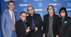 Petty accepts the ASCAP Founders Award from (l-r) ASCAP VP of Pop/Rock Membership Marc Emert-Hutner and President Paul Williams, Jackson Browne and ASCAP EVP of Membership John Titta